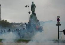 Police, protesters clash in Paris as tens of thousands rally across France